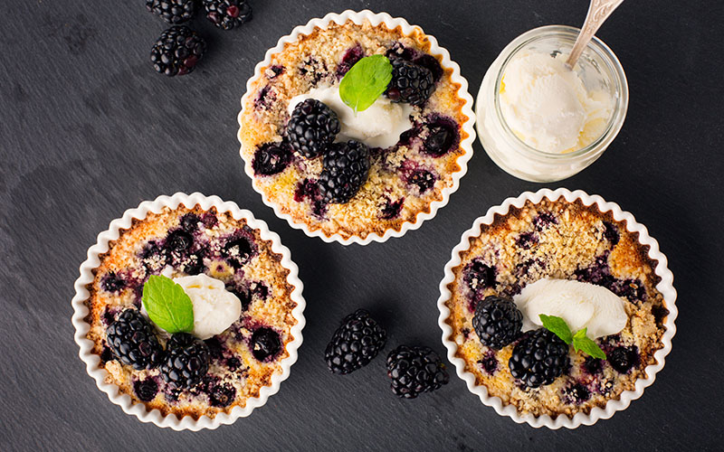 This is an image of 3 small marion berry pies.